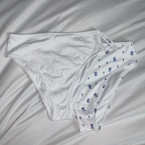 2 pack of white bikini bottoms. Women’s size Large. High waisted. Cheeky.